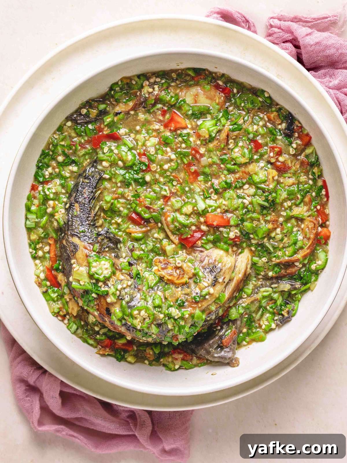okro soup with smoked mackerel in a bowl.