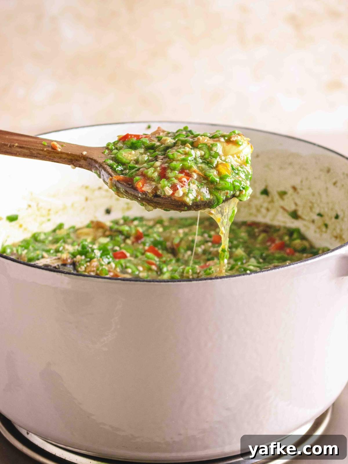 A photo showing a drawy okro soup