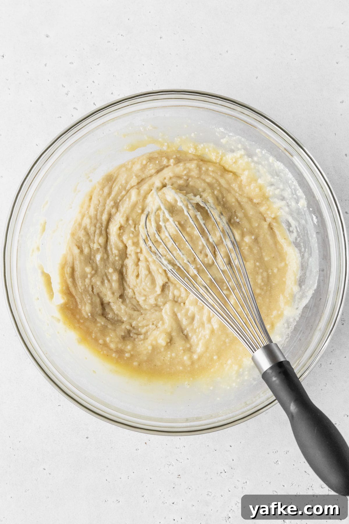 How to Make Dairy-Free Cupcakes 6 Dry ingredients added to wet ingredients for making dairy-free cupcakes, but the batter is still thick and lumpy because the dairy-free milk is yet to be added.