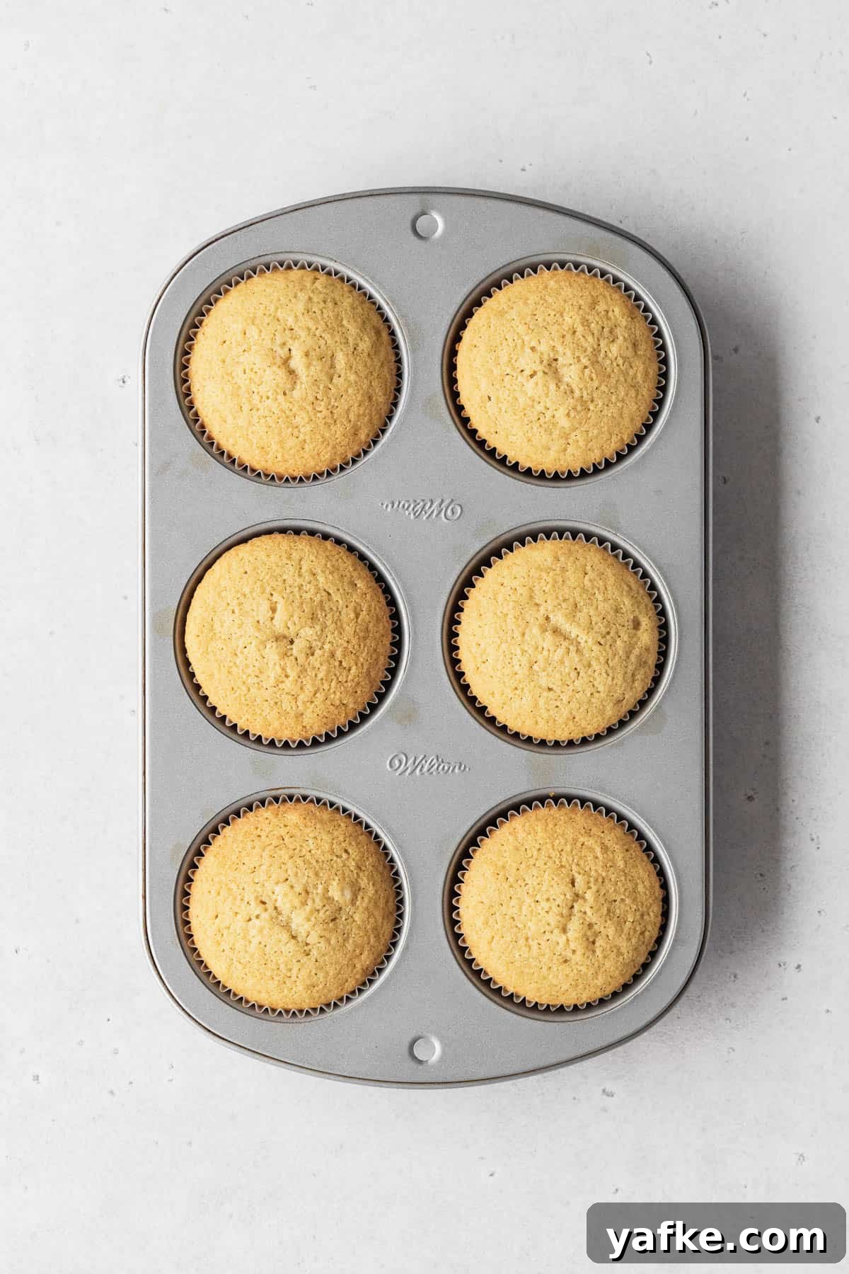 How to Make Dairy-Free Cupcakes 9 Muffin tin filled with 6 perfectly baked dairy-free vanilla cupcakes.