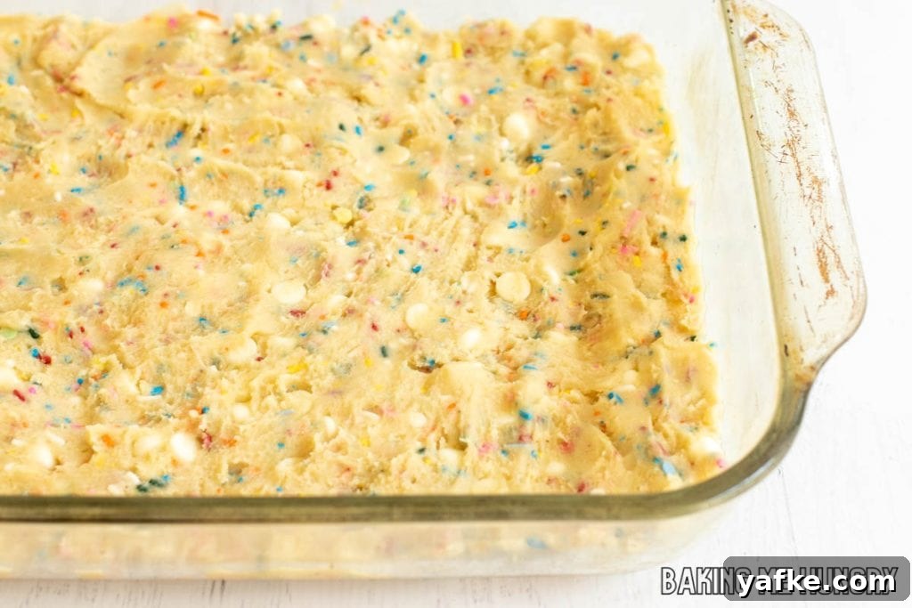 Birthday Cake Blondies Recipe with Sprinkles 9 dough pressed into pan