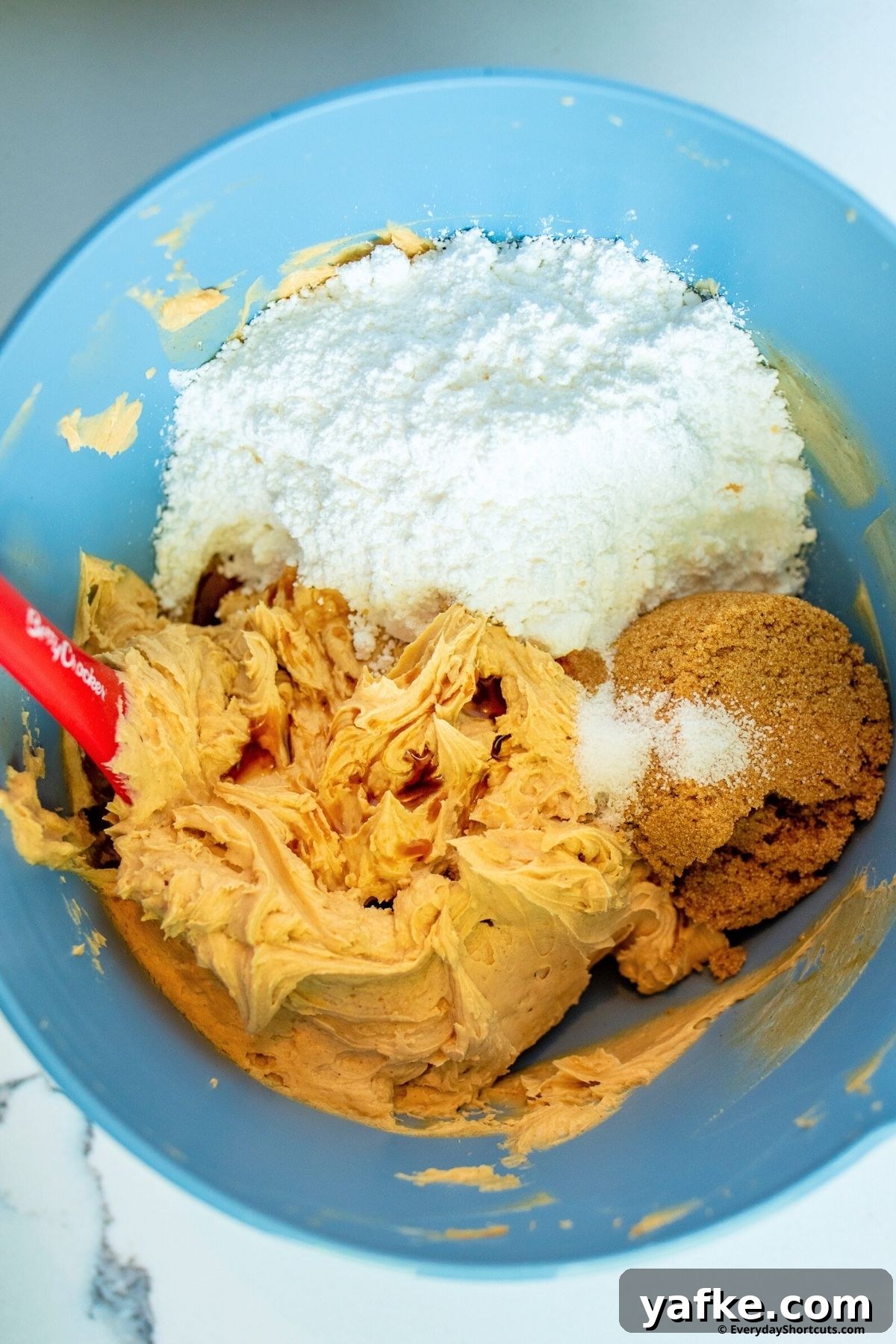 No-Bake Monster Cookie Dough Dip Recipe for Parties 6 sugars salt with peanut butter cream cheese and butter in a bowl