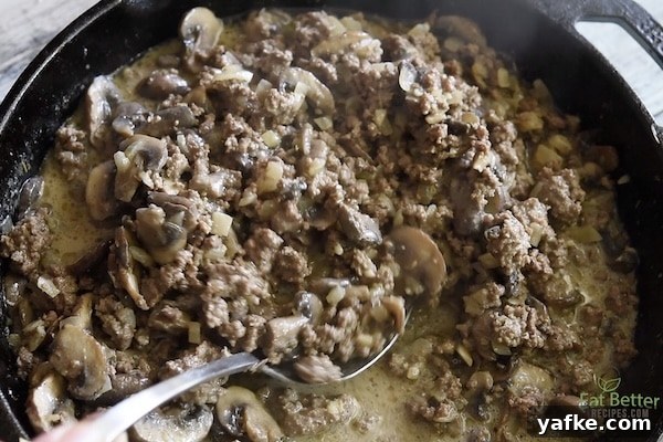 Scooping out beef and mushrooms