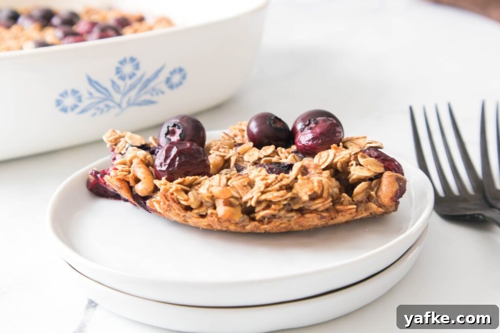 Blueberry Baked Oatmeal Blueberry Baked Oatmeal on a white plate