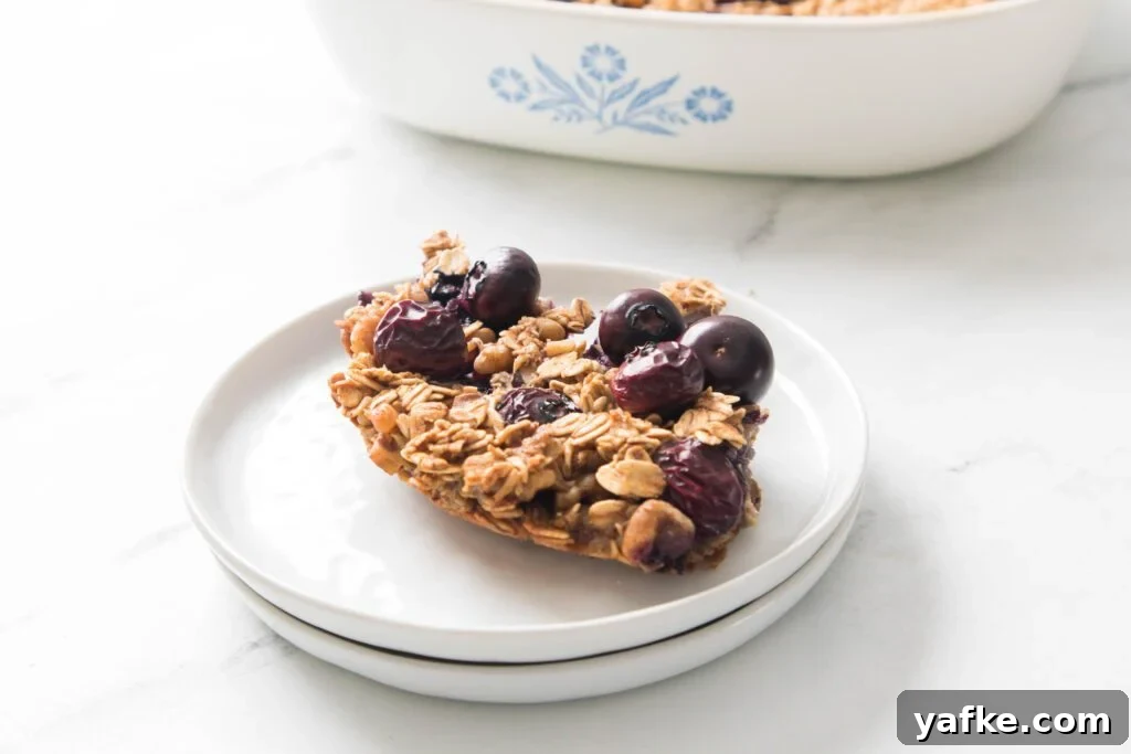 Blueberry Baked Oatmeal Blueberry Baked Oatmeal on a white plate