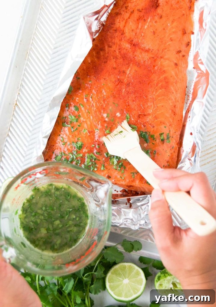 Zesty Oven-Baked Lime Salmon with Garlic and Herbs 4 Basting lime salmon with honey-butter and cilantro