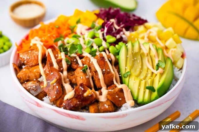 Seared Salmon Poke Bowl Recipe with Soy-Ginger Glaze 4 cooked salmon poke bowl with shredded red cabbage shredded carrot edamame pineapple mango and avocado