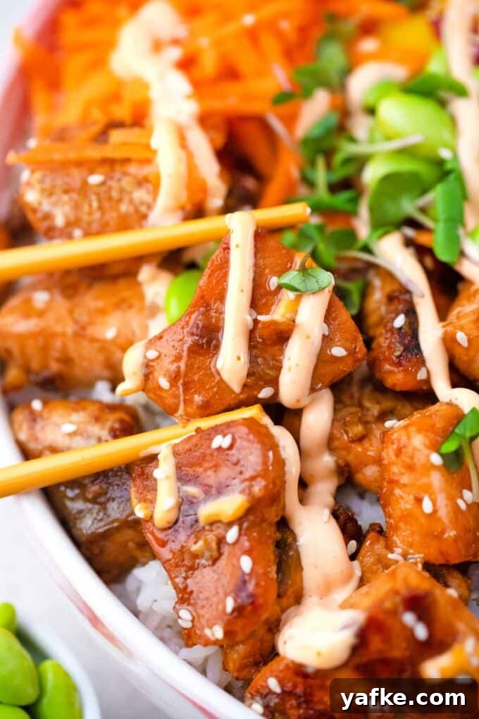 Seared Salmon Poke Bowl Recipe with Soy-Ginger Glaze 5 close shot of cooked honey garlic salmon bites