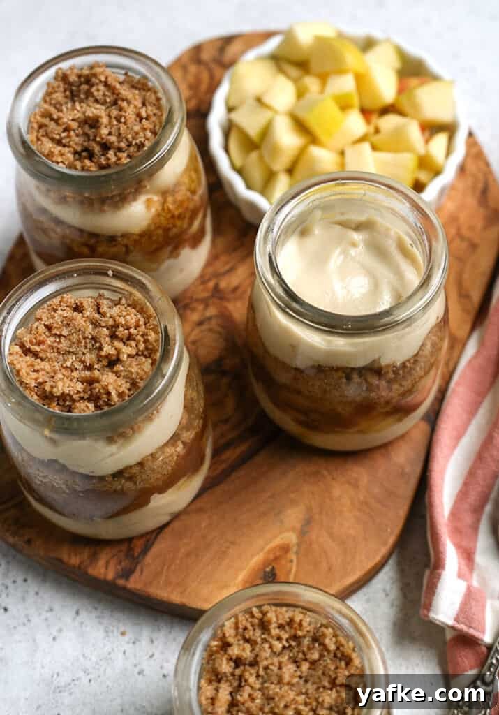 Paleo and Vegan Caramel Apple Parfaits Recipe 5 four paleo caramel apple parfaits sitting on a cutting board