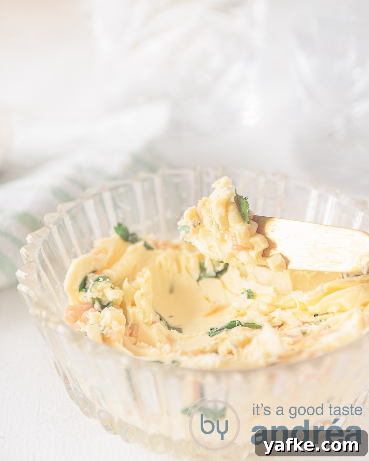 Homemade Garlic Herb Butter Recipe 5 Homemade garlic butter in a glass bowl with a knife