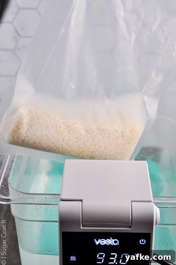 vacuum sealed bag of rice being placed in a sous vide water bath | i sugar coat it