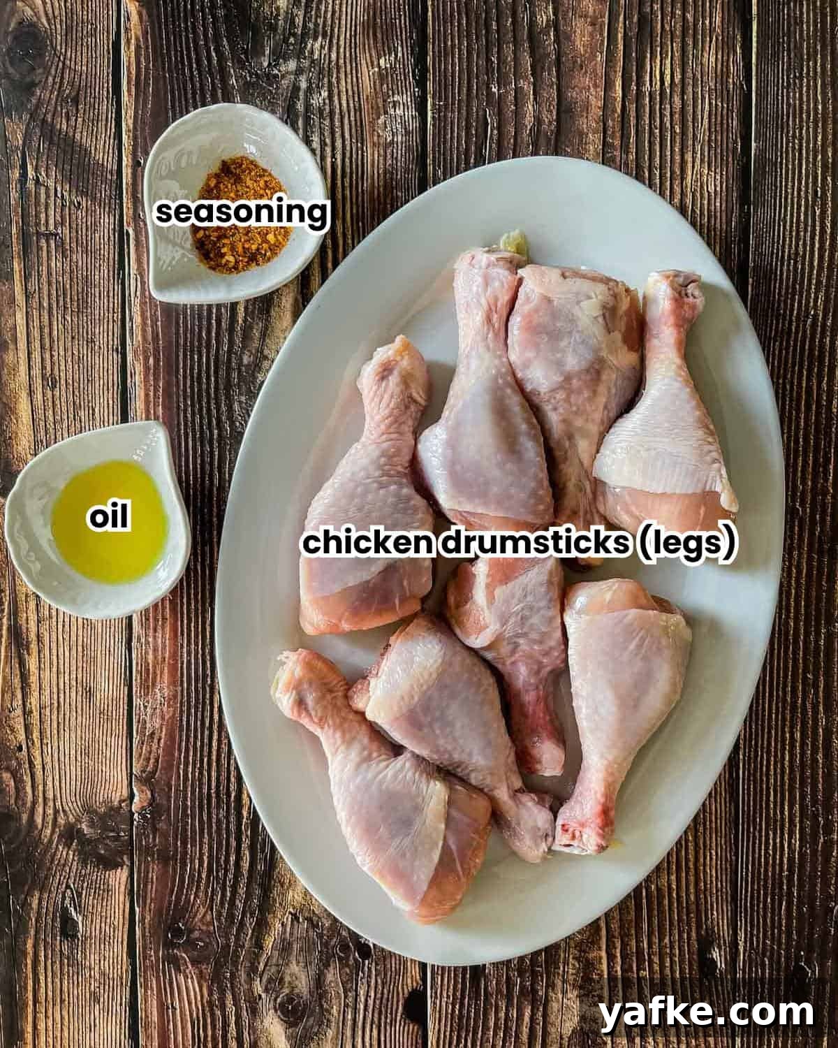 Juicy Instant Pot Chicken Drumsticks 2 Ingredients for instant pot chicken drumsticks placed on a wooden table.