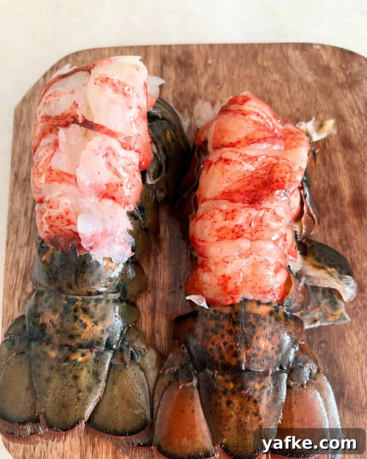 Oven-Baked Lobster Tails with Garlic Butter 4 Prepared lobster tails with top skin removed.