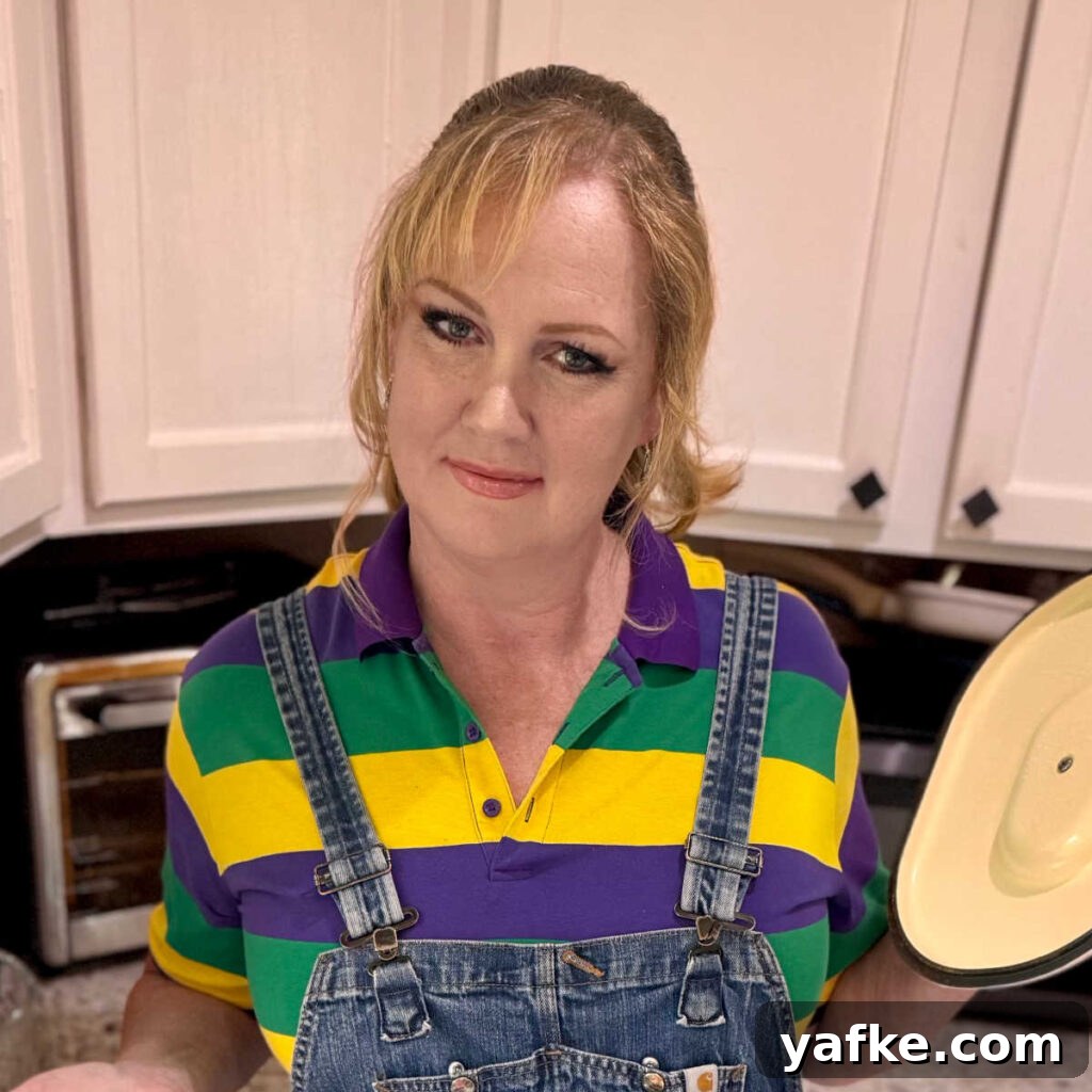 Creamy Remoulade Sauce Recipe for Seafood and Sandwiches 11 A picture of Melanie Cagle showing something in a cooking pot.
