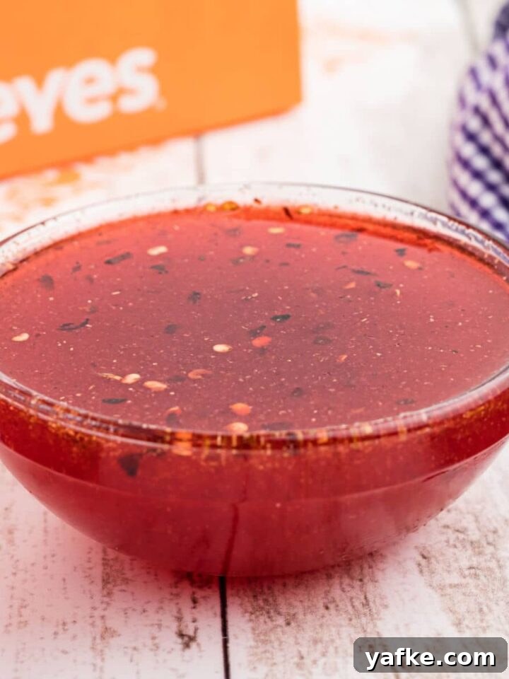 Close up of a bowl of popeyes sweet heat sauce recipe.