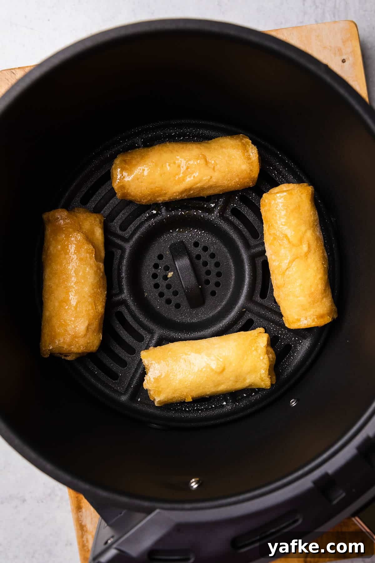 How to Air Fry Tai Pei Frozen Egg Rolls 4 tai pei egg rolls in the air fryer basket