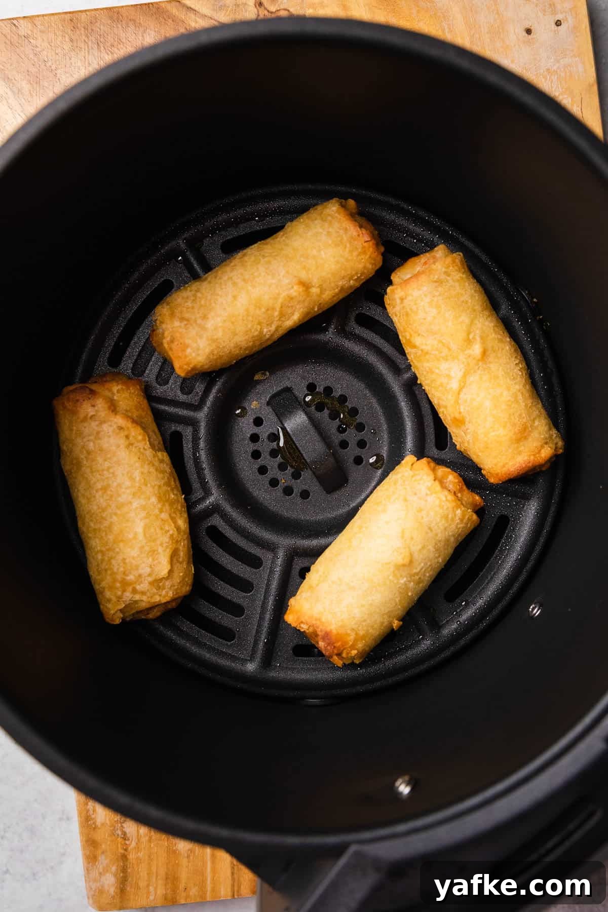 How to Air Fry Tai Pei Frozen Egg Rolls 5 tai pei egg rolls in the basket after being air fried