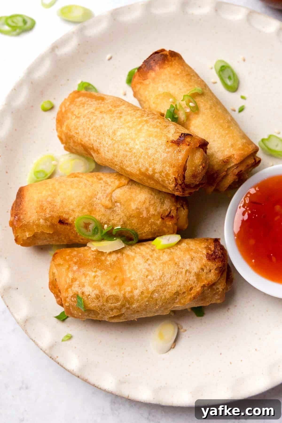 How to Air Fry Tai Pei Frozen Egg Rolls 6 the completed recipe served on a plate