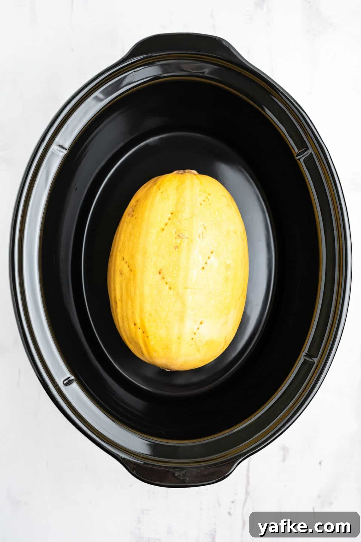 Slow Cooker Spaghetti Squash Recipe 5 Spaghetti squash in the slow cooker after it's cooked.