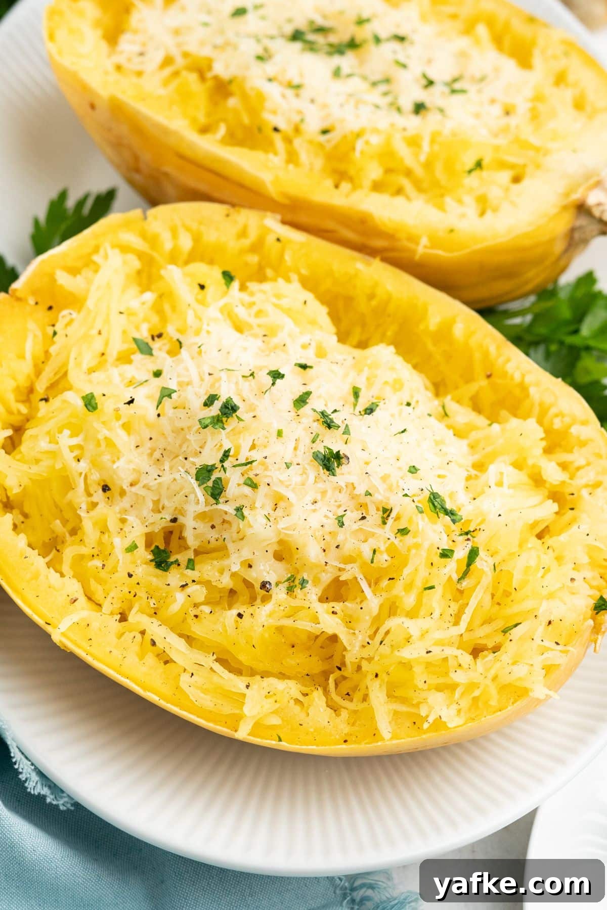 Slow Cooker Spaghetti Squash Recipe 9 A close up of crockpot spaghetti squash on a plate.