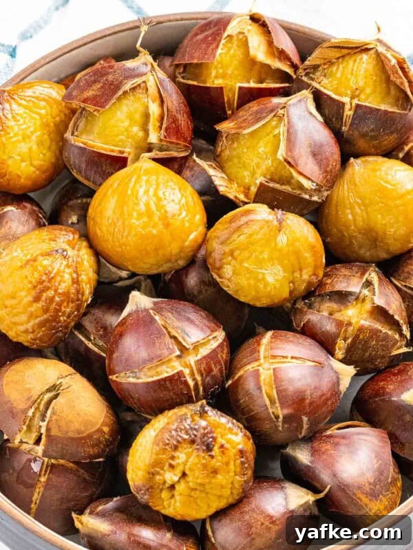 How to Make Quick Candied Chestnuts (Marrons Glacés) 6 Roasted chestnuts with outer shell peeled back.