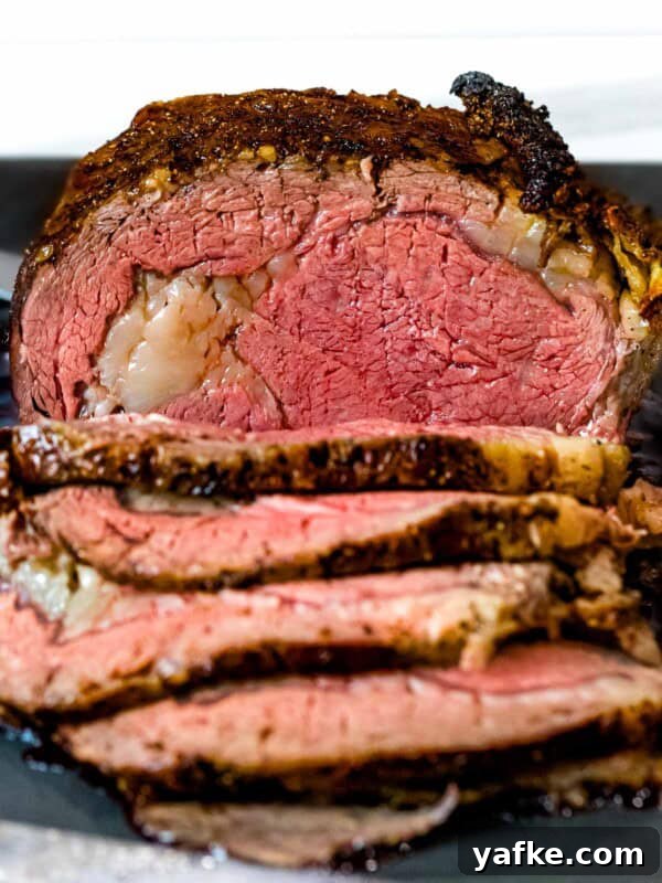 How to Make Quick Candied Chestnuts (Marrons Glacés) 9 Prime rib roast with brown crust cut into slices on a dark cutting board.