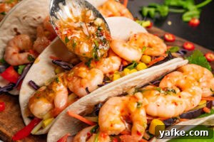 Crispy Shrimp Tacos with Sweet Chili Sauce 9 Prawn tacos filled with salad and sweet chilli sauce over the top