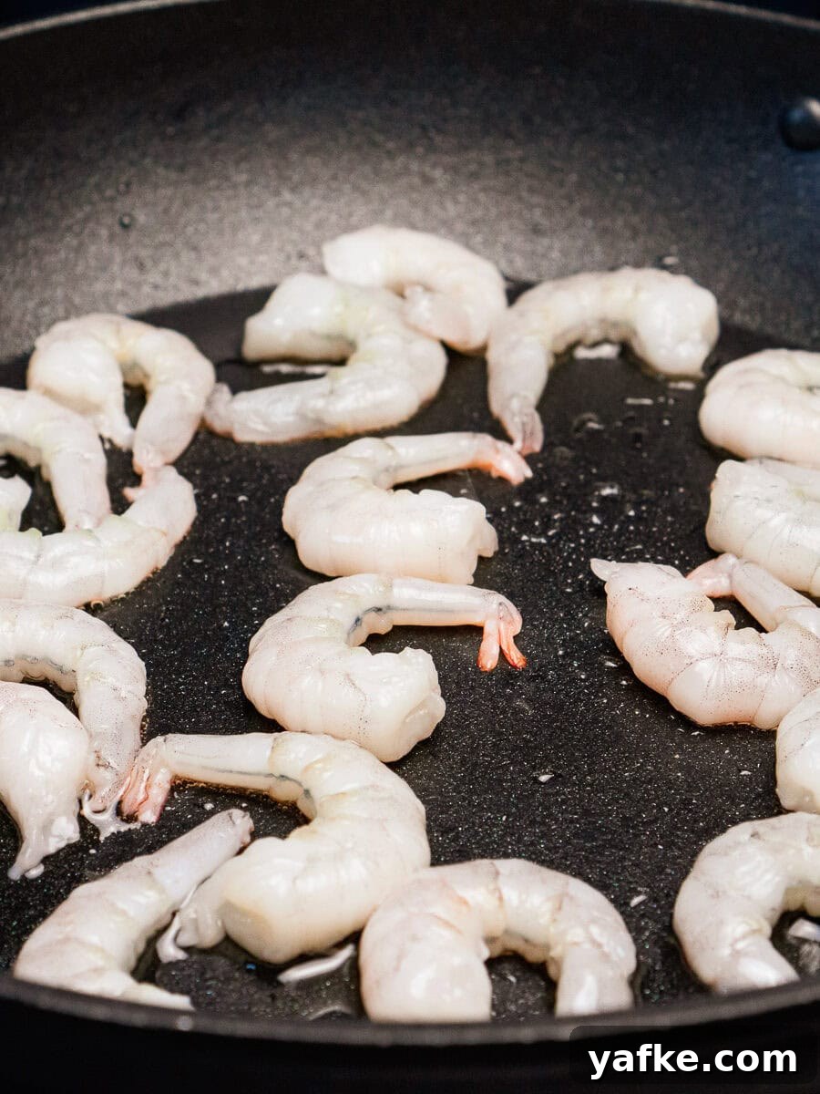 Crispy Shrimp Tacos with Sweet Chili Sauce 11 Frying king prawns in a frying pan