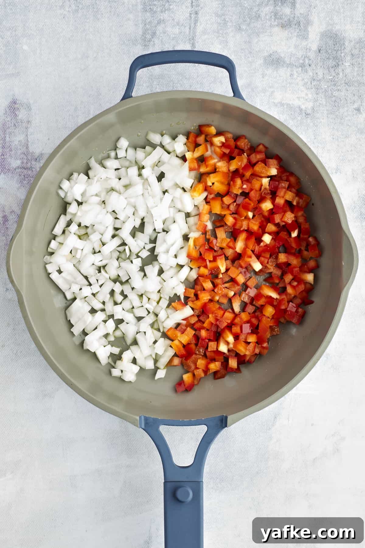 One-Pan Shakshuka with Feta and Fresh Herbs 2 onions and peppers in a large pot