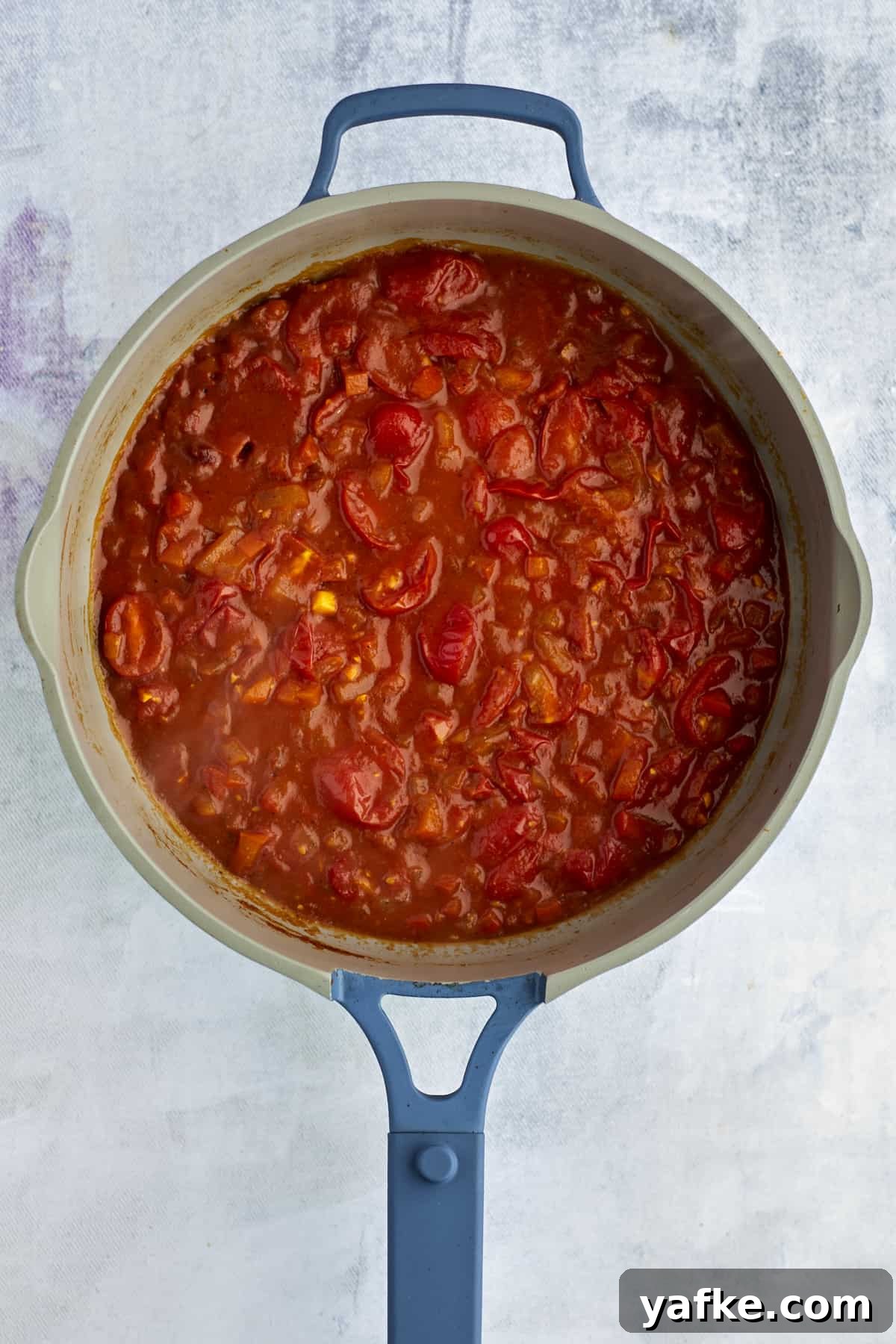 One-Pan Shakshuka with Feta and Fresh Herbs 6 simmered shakshuka sauce in a pot