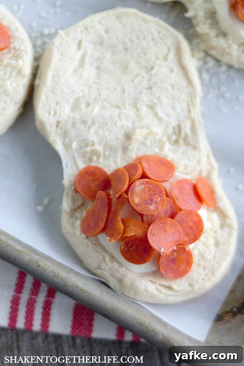 How to Make Pizza-Stuffed Waffles with Canned Biscuits 2 Pizza Stuffed Waffles start with refrigerator biscuits. Open them up and stuff in fresh mozzarella and your favorite pizza toppings. Then, pop them in your waffle maker!