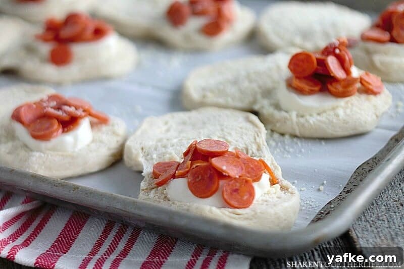 How to Make Pizza-Stuffed Waffles with Canned Biscuits 3 Pizza Stuffed Waffles start with refrigerator biscuits. Open them up and stuff in fresh mozzarella and your favorite pizza toppings. Then, pop them in your waffle maker!