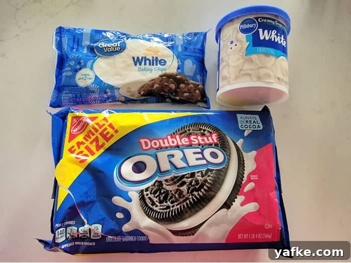 No-Bake 3-Ingredient Oreo Fudge Recipe 3 chocolate chips, vanilla icing, and oreo package on a counter