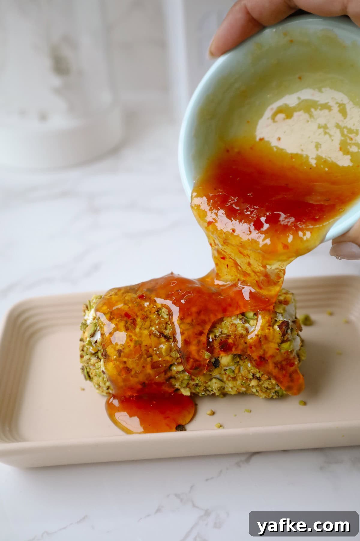 Festive Goat Cheese Appetizer Recipes for Holiday Parties 6 Step four: pour the jam onto the goat cheese appetizer.
