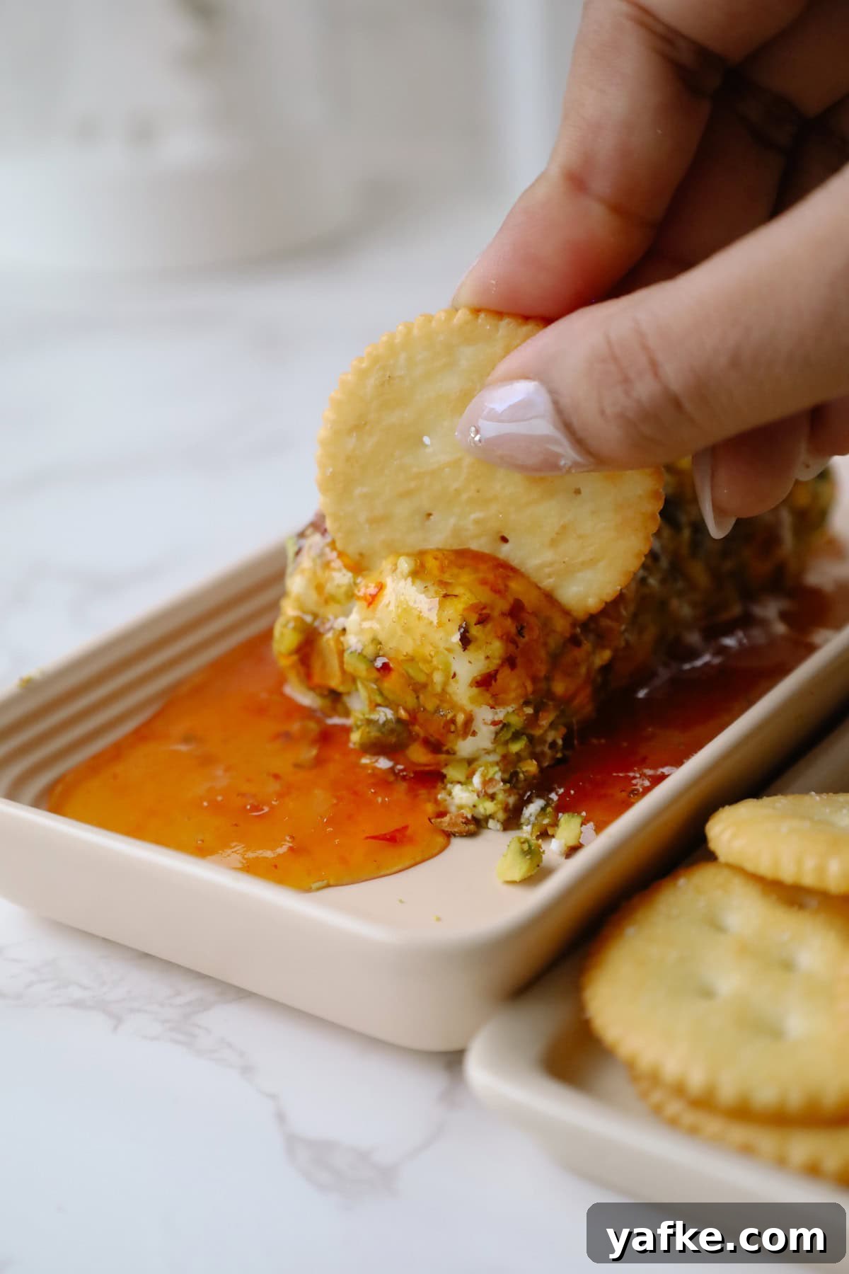 Festive Goat Cheese Appetizer Recipes for Holiday Parties 7 Goat cheese appetizer served with crackers.