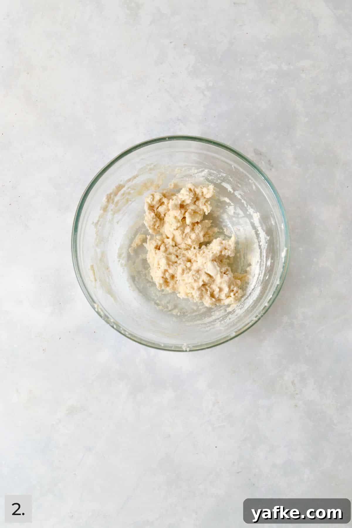 Single-Serve Biscuits and Sausage Gravy for One 5 Dough to make one biscuit in a bowl.