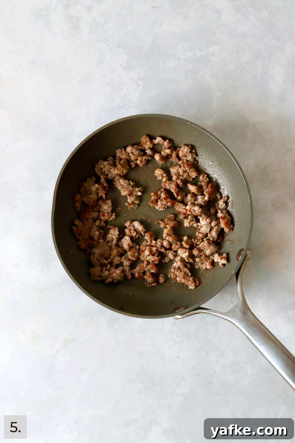 Single-Serve Biscuits and Sausage Gravy for One 8 Ground pork sausage crumbled and cooked in a skillet.