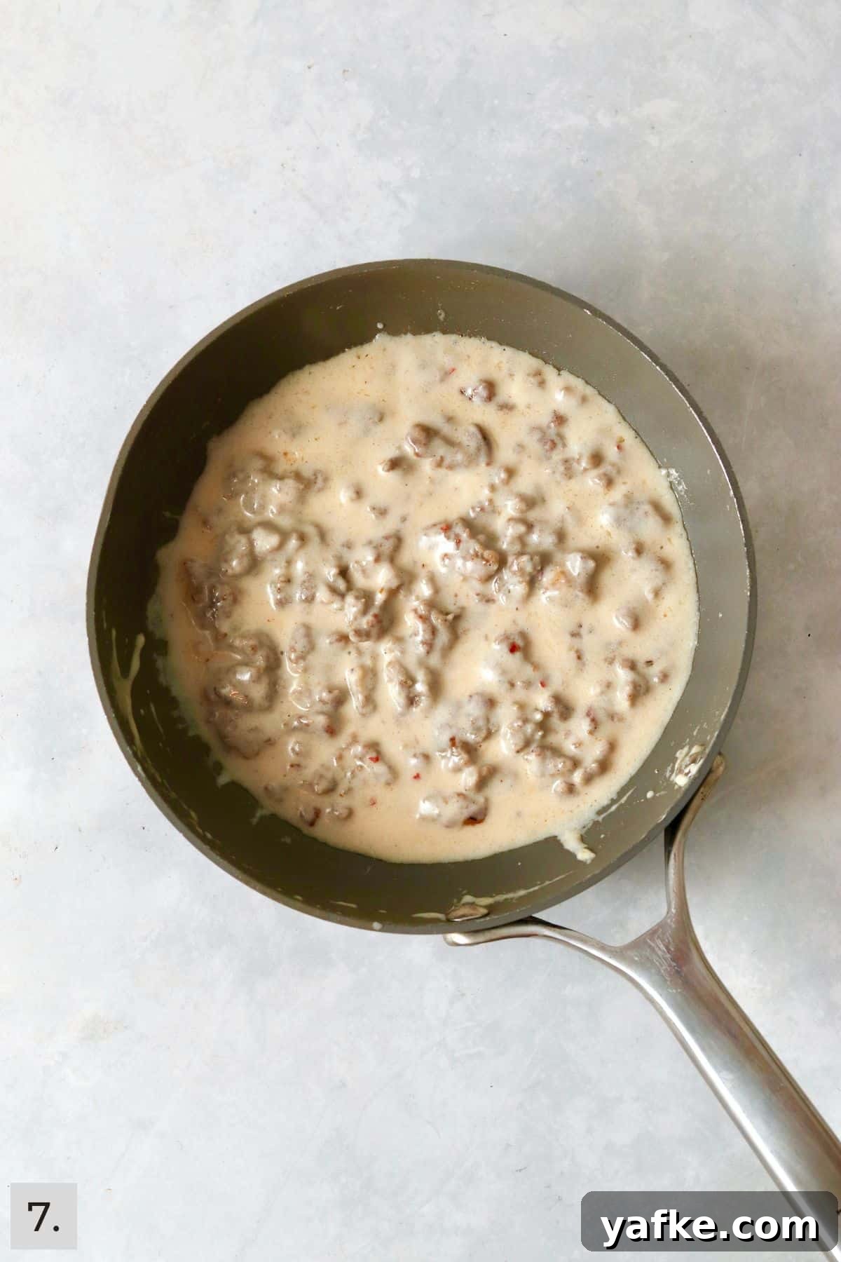Single-Serve Biscuits and Sausage Gravy for One 10 Small batch of sausage gravy in a skillet.