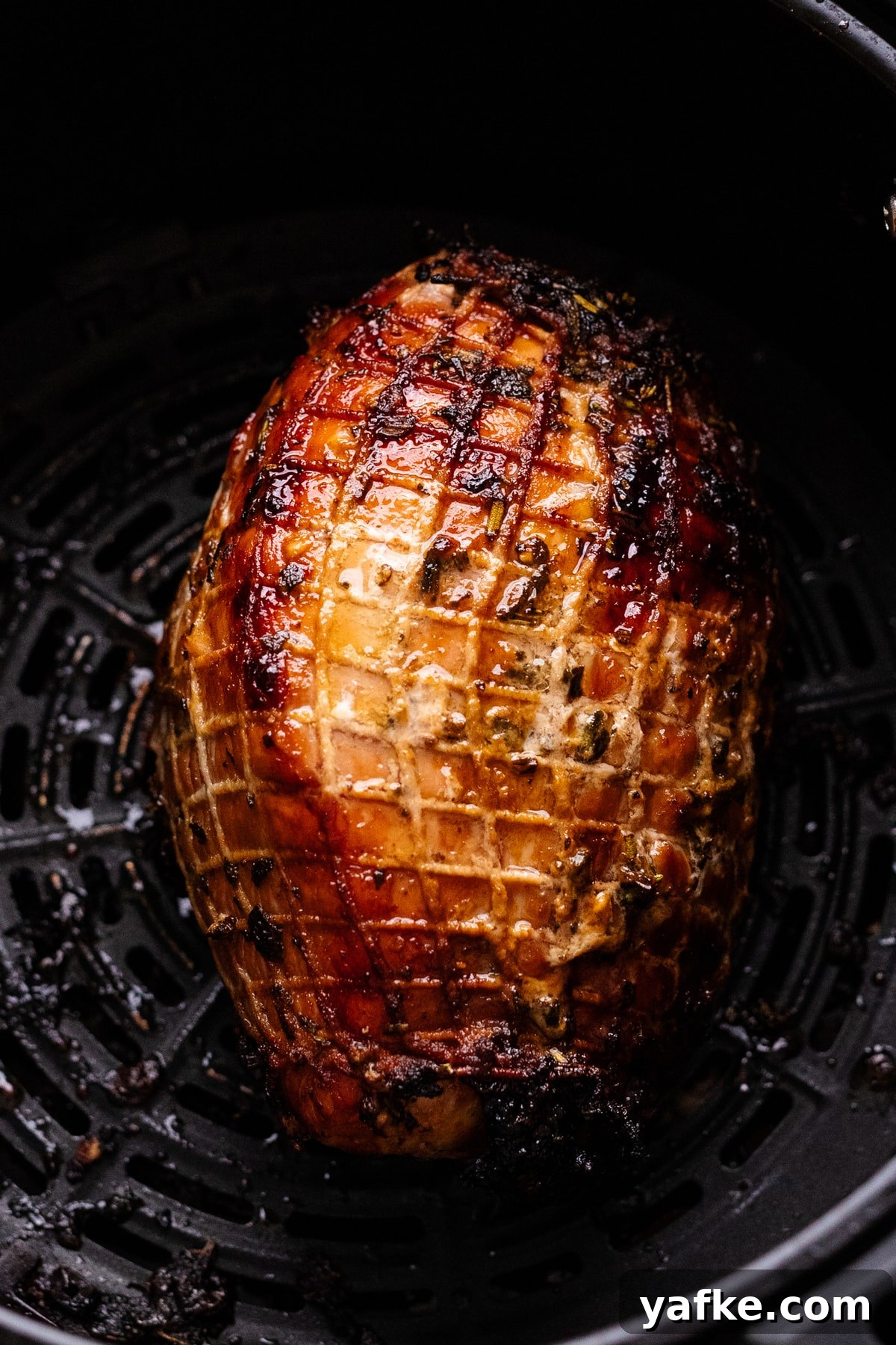 Juicy Maple Herb Air Fryer Turkey Breast 7 A roasted turkey breast in an air fryer.