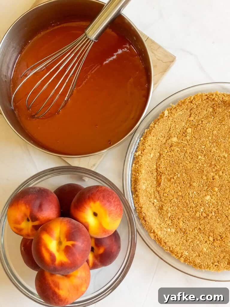 How to Make Authentic Amish Fresh Peach Pie 3 peach sauce in a saucepan, peaches in a bowl, and a graham cracker crust.