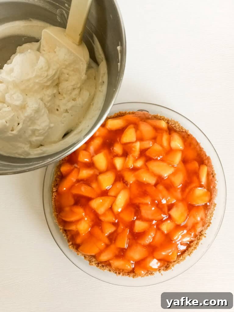 How to Make Authentic Amish Fresh Peach Pie 6 9" fresh peach pie and a bowl of whipped cream.