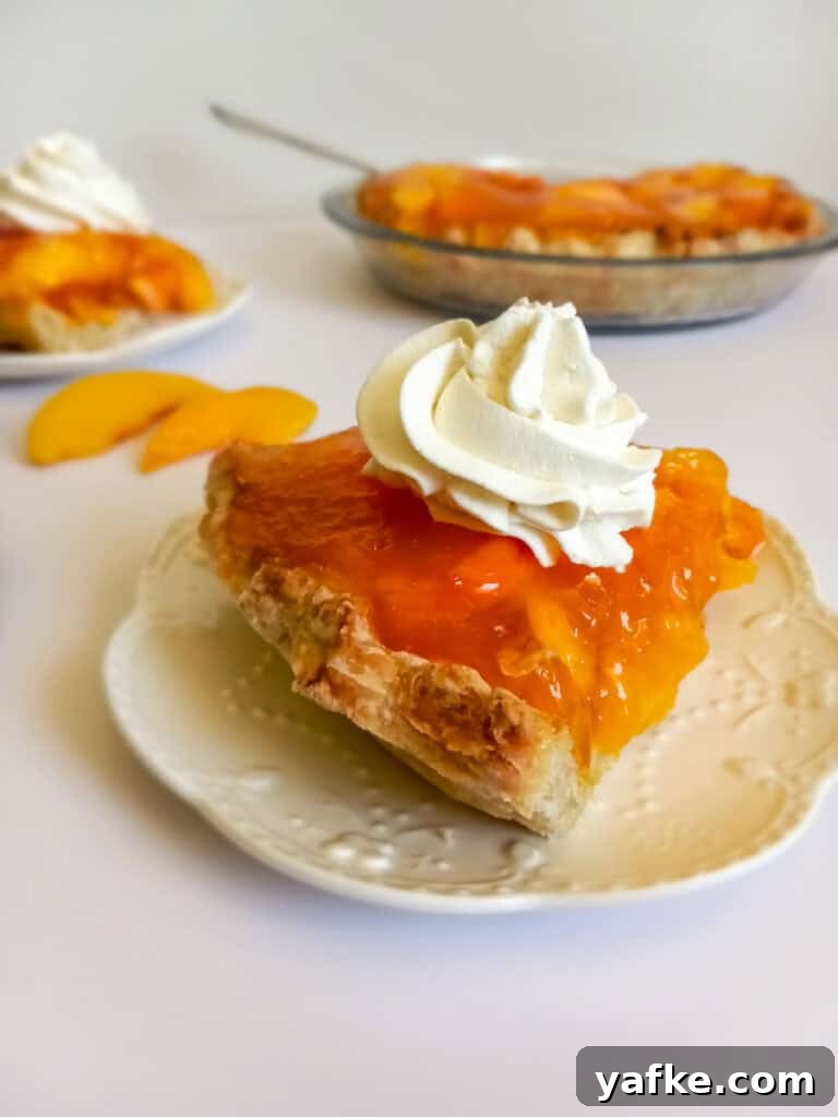 How to Make Authentic Amish Fresh Peach Pie 8 a slice of fresh peach pie with a flaky crust.