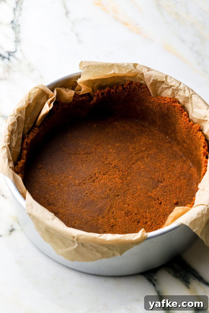 Creamy Lotus Biscoff Cheesecake Recipe 3 biscoff crust pressed into pan