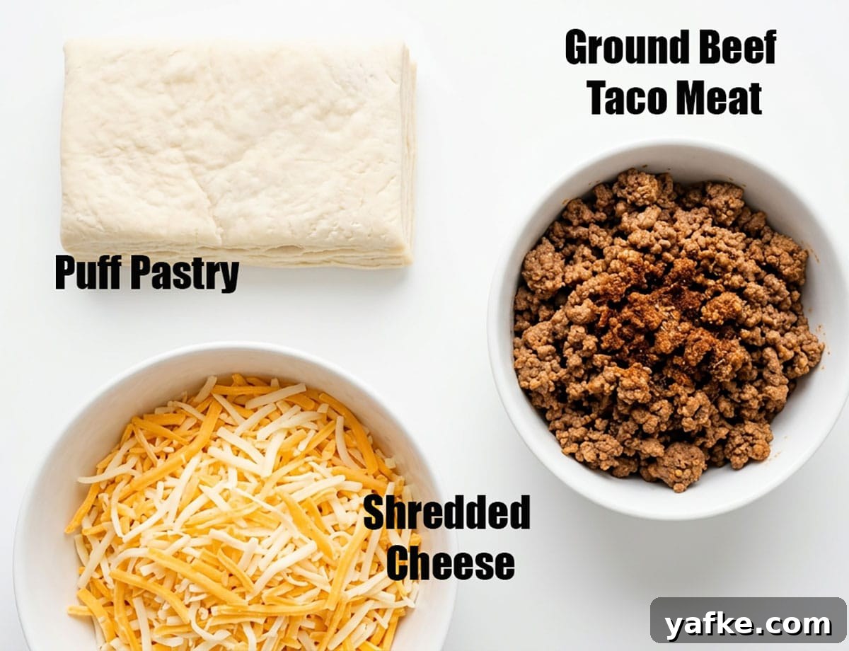 One-Pan Ground Beef Puff Pastry Pie 3 Ingredients for recipe on white background- Pastry dough, cooked meat, shredded cheese.