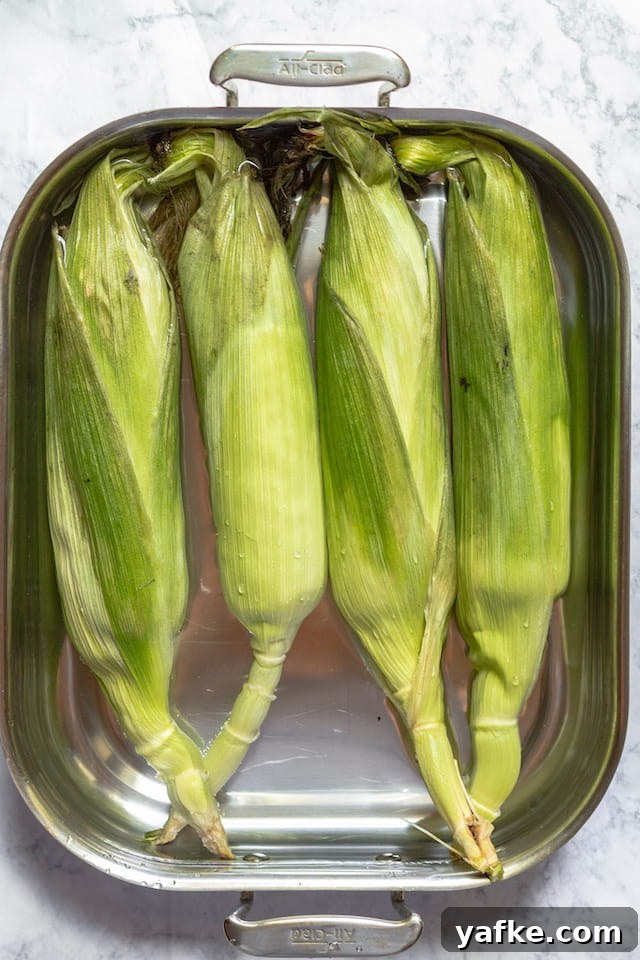 How to Grill Corn in the Husk for Smoky, Tender Kernels 2 How to Grill Corn in the Husk Soaking in Water