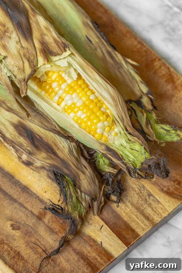How to Grill Corn in the Husk for Smoky, Tender Kernels 5 How to Grill Corn in the Husk on Cutting Board