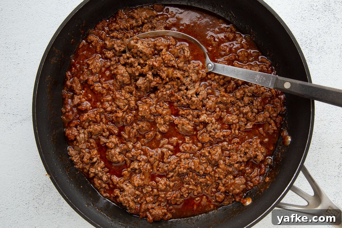 Classic Old Fashioned Sloppy Joes Sandwich Recipe 5 ground beef in a tomato based sauce in a large skillet.