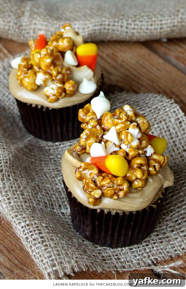 Caramel Corn Cupcakes for Halloween - caramel cupcakes topped with caramel frosting and caramel popcorn studded with candy corn and cashews | by Lauren Kapeluck for TheCakeBlog.com