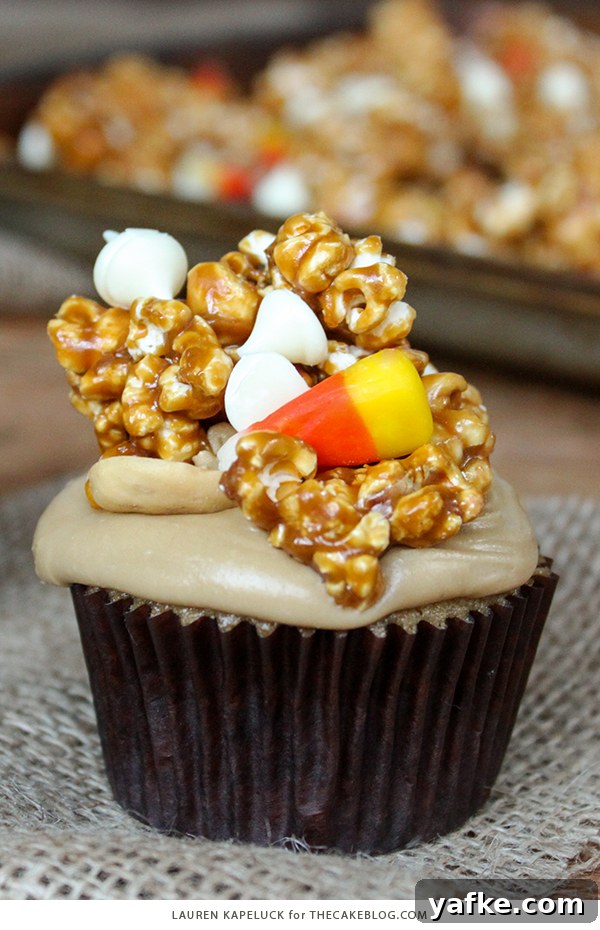 Caramel Corn Cupcakes for Halloween - caramel cupcakes topped with caramel frosting and caramel popcorn studded with candy corn and cashews | by Lauren Kapeluck for TheCakeBlog.com