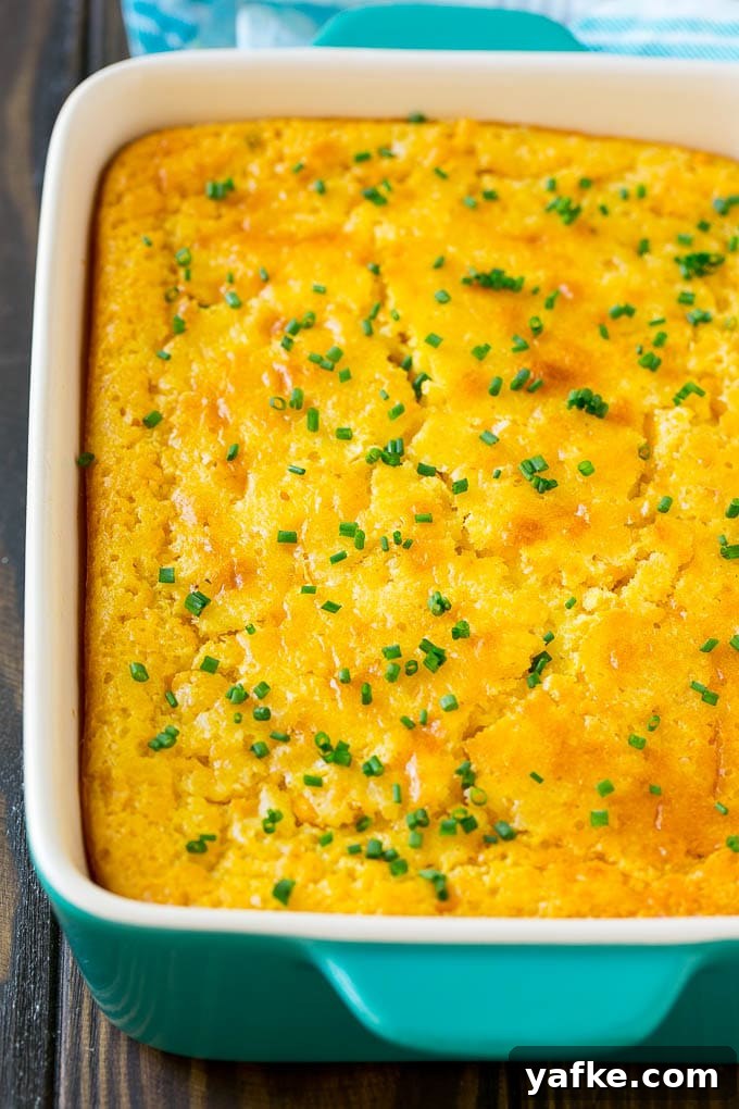 Baked Corn Pudding A casserole dish of corn pudding topped with chives.